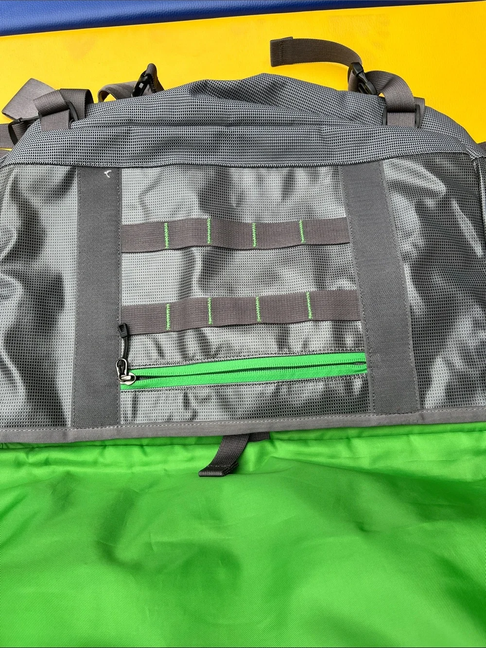 Patagonia’s Gray Messenger Bag with Green Accents older black hole